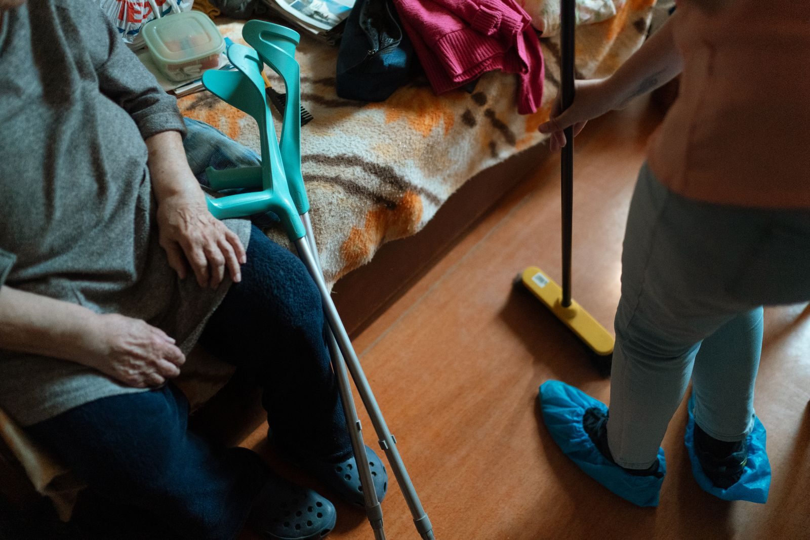 REACH Home Care caregiver folding laundry in a senior client's home
