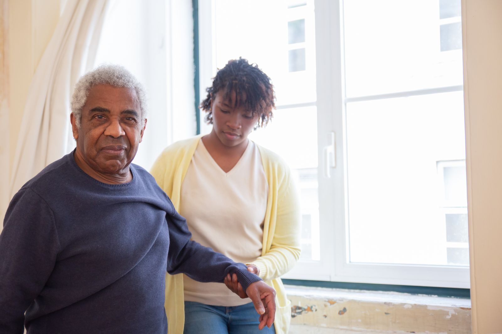 REACH Home Care caregiver with a senior client at home in the Tri-Cities