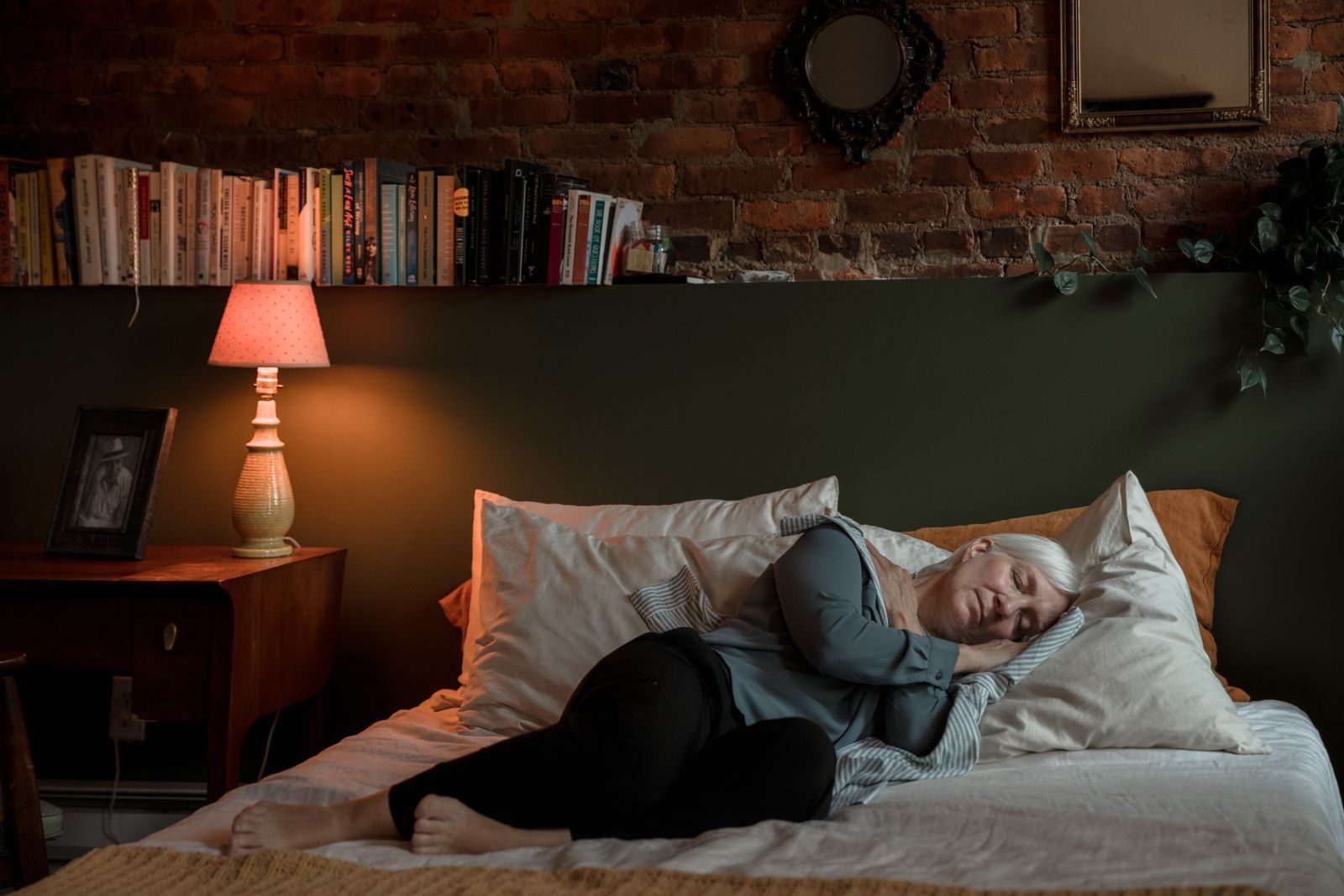 REACH Home Care overnight caregiver watching over a senior client at home in the Tri-Cities