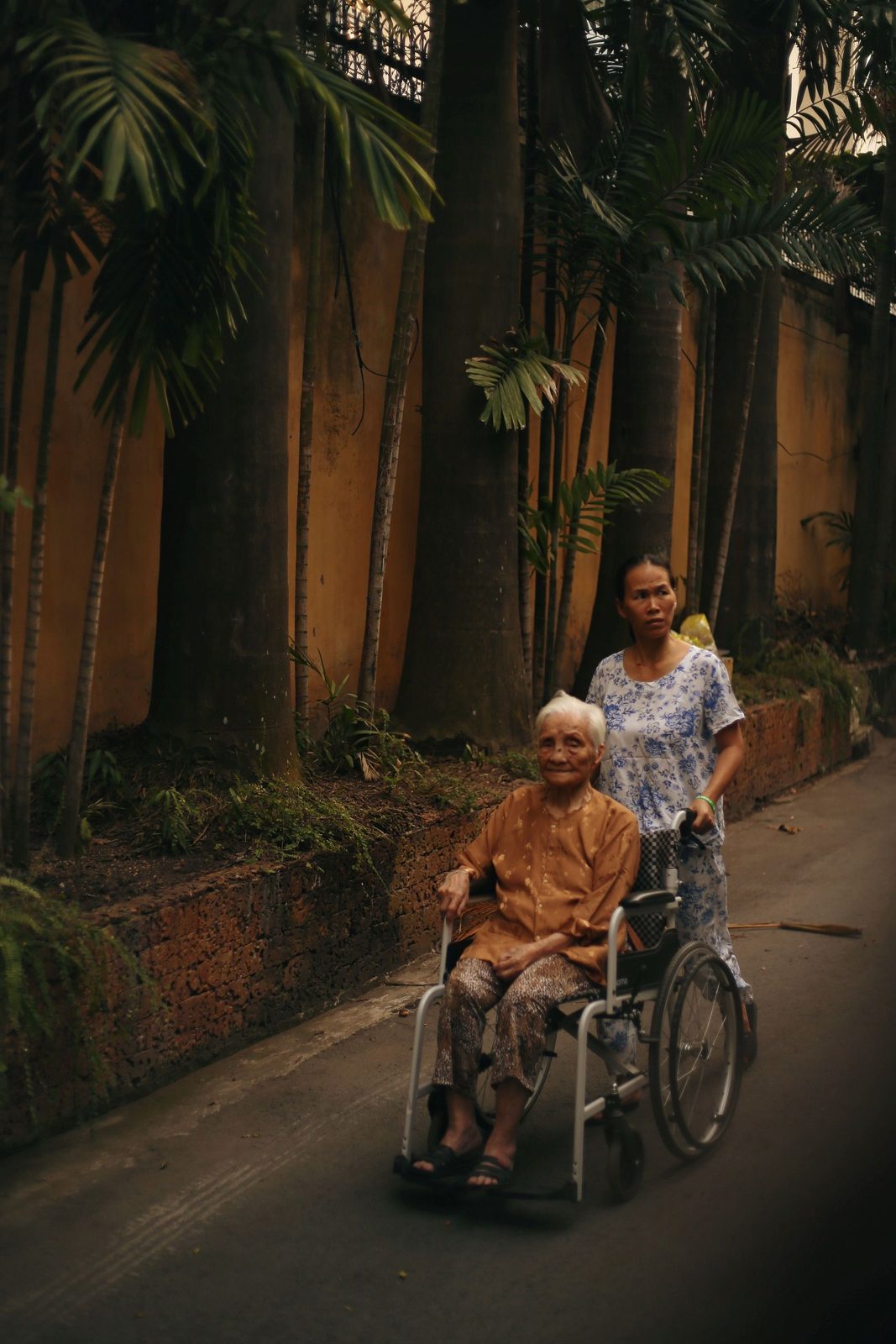 REACH Home Care caregiver assisting an adult client with a disability in his home